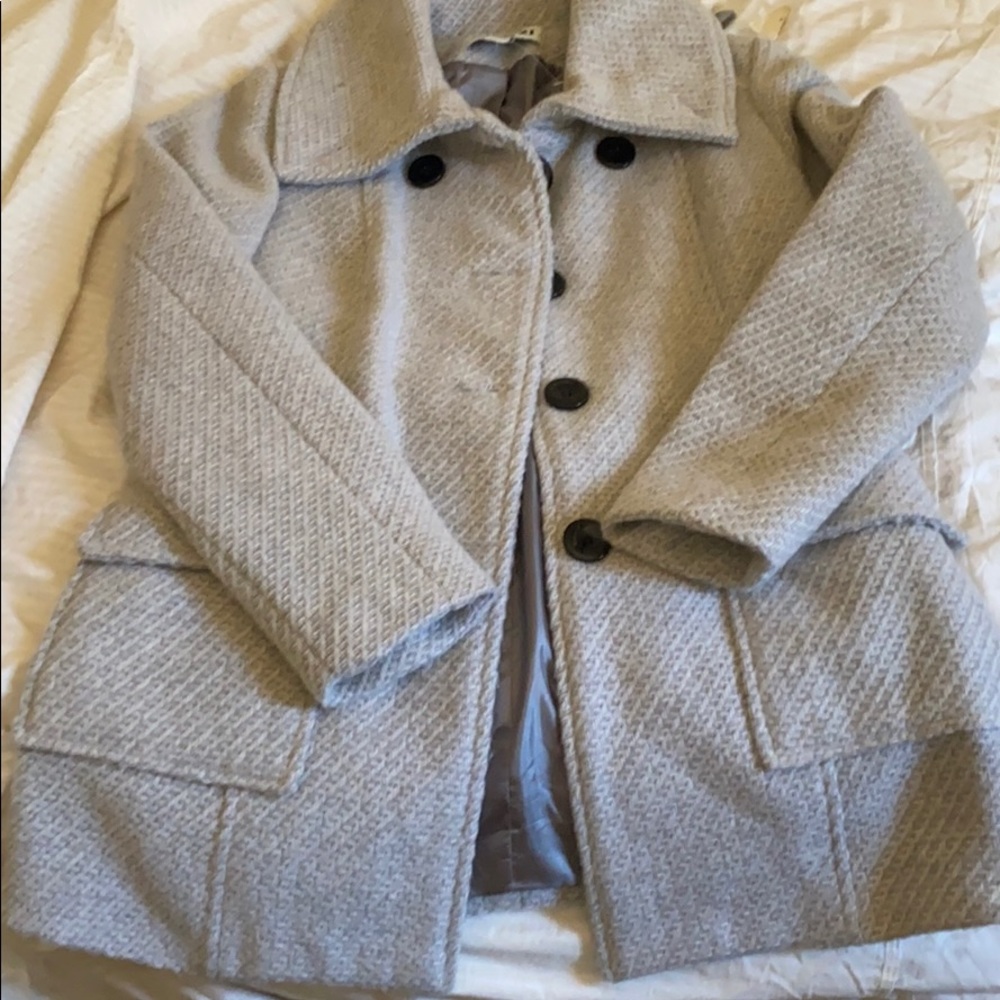 Light grey coat black buttons